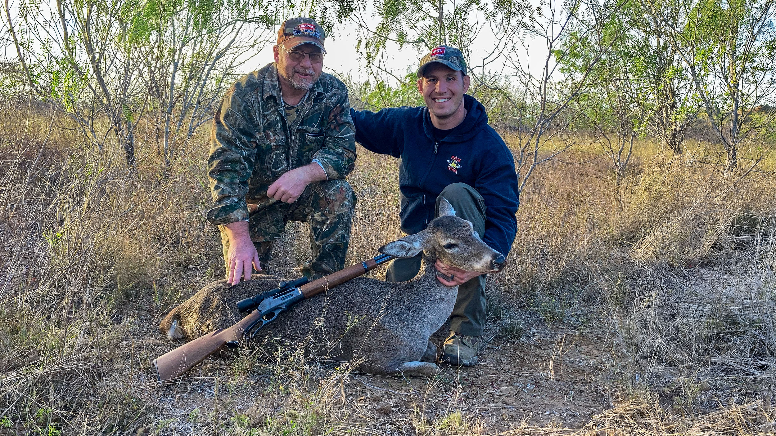 disabled veteran on guided South Texas management doe hunt at The Ranch with harvested whitetail doe